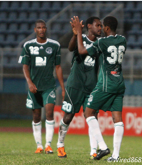 Photo: Joevin Jones (number 36) is congratulated by W Connection teammate Silvio Spann. JJ is in flying form of late. (Courtesy Wired868)