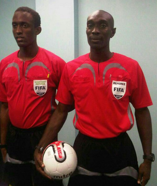 Photo: Referee Joel Davidson (right) and referee's assistant Caleb Wales might have gotten their wires crossed yesterday.