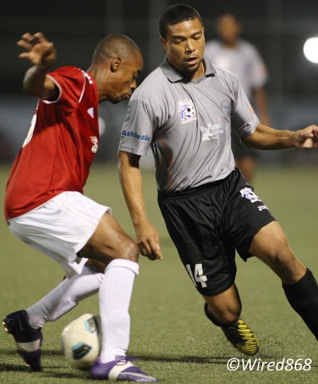 Photo: St Ann's Rangers attacker Cameron Roget (right) eludes Central FC defender Carey Harris on Tuesday. (Courtesy Wired868)