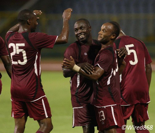 Photo: North East Stars utility player Kennedy Hinkson (second from right) gets a congratulatory hug from Jeromie Williams while Keryn Navarro (number 25) joins in. (Courtesy Wired868)
