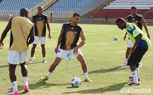 Photo: Trinidad and Tobago veteran wing back Carlos Edwards (centre) trains with teammates (from right) Darryl Roberts, Marvin Phillip, Densill Theobald and Cornell Glen at the Hasely Crawford Stadium. (Courtesy Wired868)