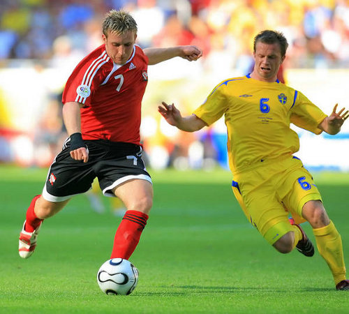 Photo: Chris Birchall (left) tries to get a shot past Sweden midfielder Tobias Linderoth during the 2006 World Cup finals. Sweden and Trinidad and Tobago played to a goalless draw in Dortmund.