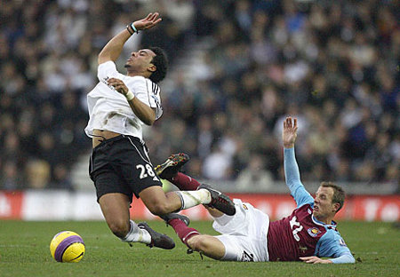 Photo: Former Derby County winger Giles Barnes (left) is hacked down by West Ham's Lee Bowyer in the English Premiership. Barnes now represents Houston Dynamo.