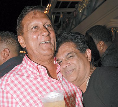 Photo: Health Minister Dr Fuad Khan (right) seems to like what he is smelling from business Ish Galbaransingh, who is fighting attempts by the US Government to extradite him for corrupt practices. Is that Eau de Corruption, I'm smelling? (Courtesy Trinidad Guardian)